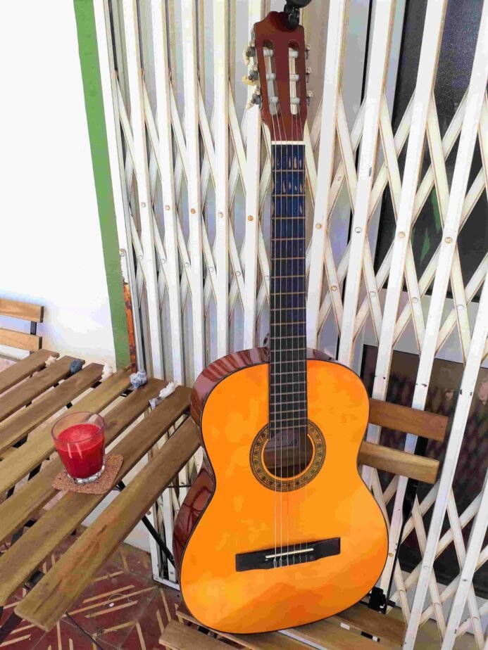 Acoustic guitar for rent at Faro Surf Rentals, Portugal