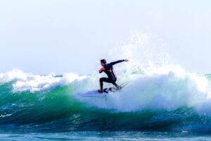 Surfer riding a wave in the Algarve