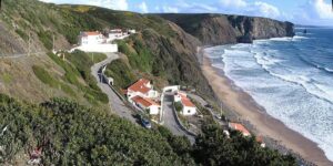 Clean lines of swell wrapping into the sheltered bay at Arrifana on the Algarve west coast