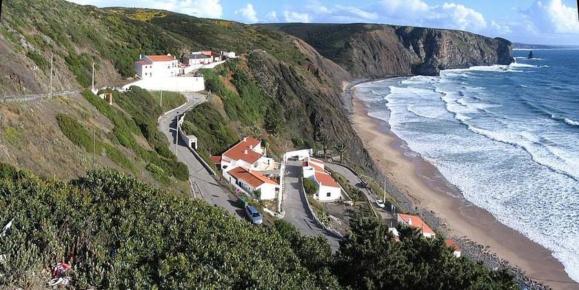 Clean lines of swell wrapping into the sheltered bay at Arrifana on the Algarve west coast