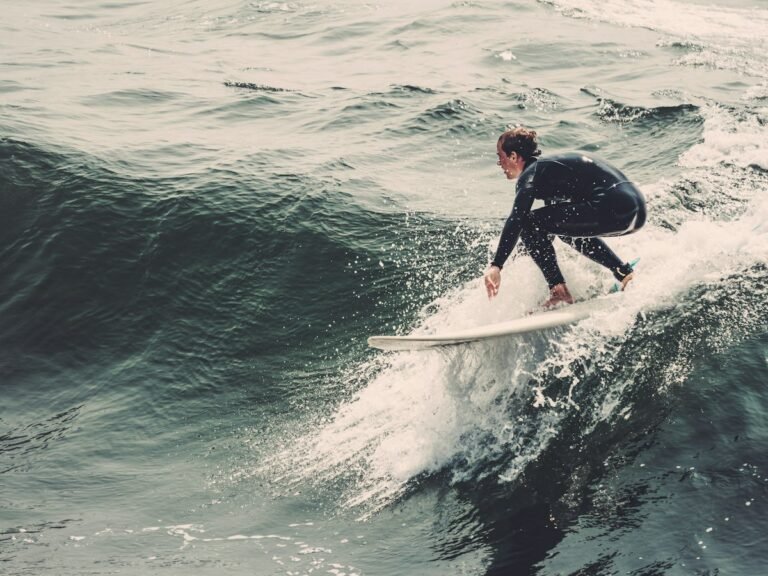 Surfer in a wetsuit riding a wave