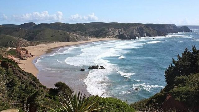 Wide sandy beach break at Amado near Carrapateira on the Algarve west coast
