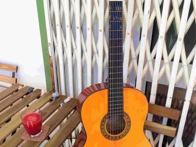 Acoustic guitar for rent at Faro Surf Rentals, Portugal